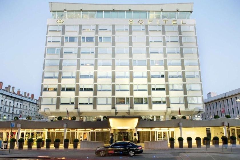 The glass facade of the Sofitel Lyon hotel, near Place Bellecour