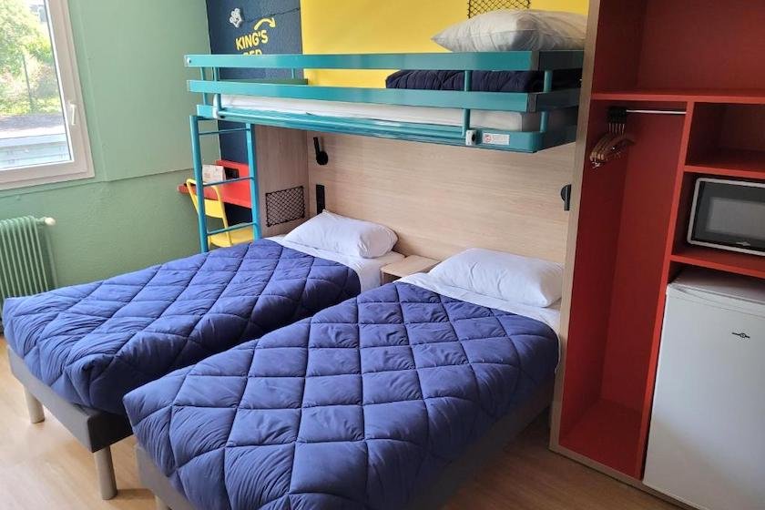 A triple room with fridge and microwave at Première Classe Lyon Nord Dardilly hotel