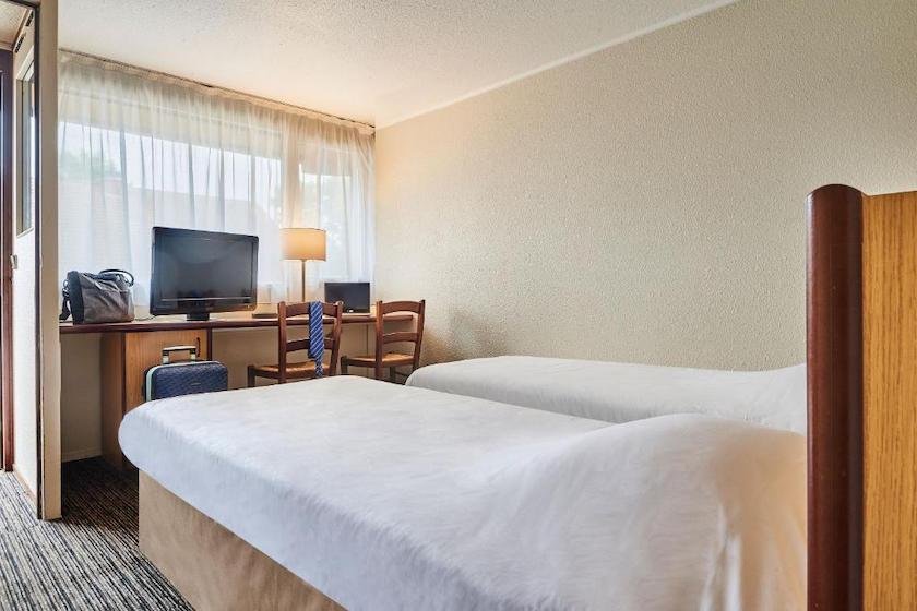 Une chambre twin de l’hôtel Kyriad Direct Lyon Sud - Chasse-sur-Rhône